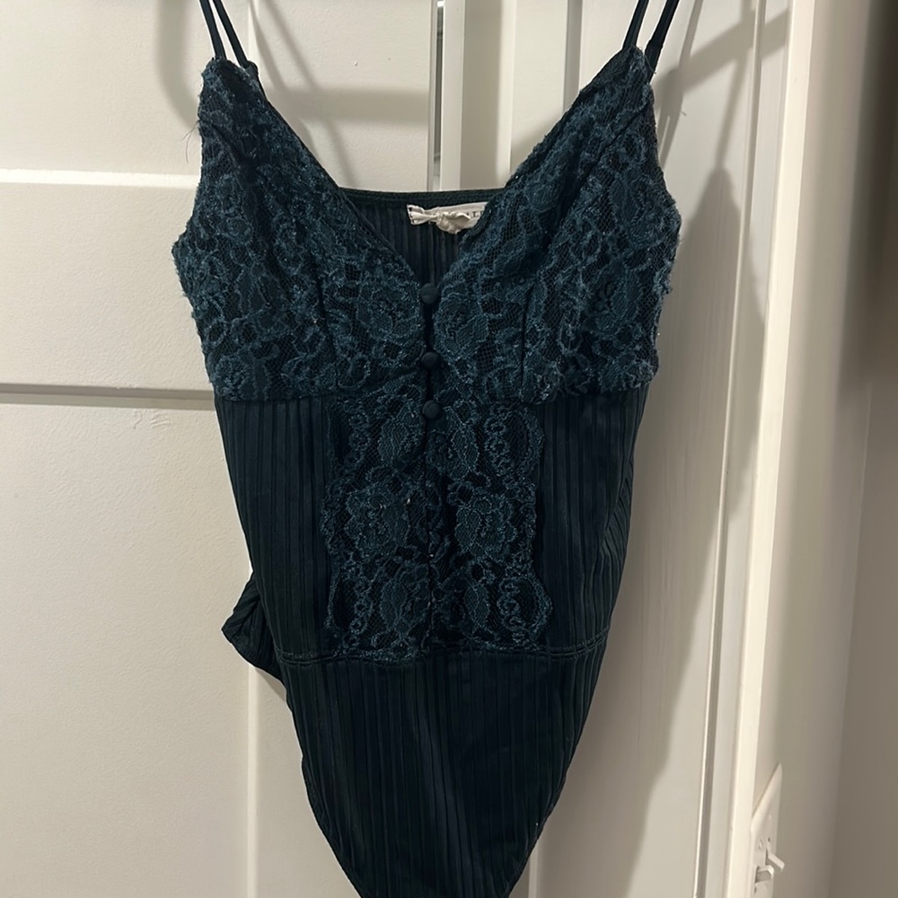 Dark green bodysuit with lace details